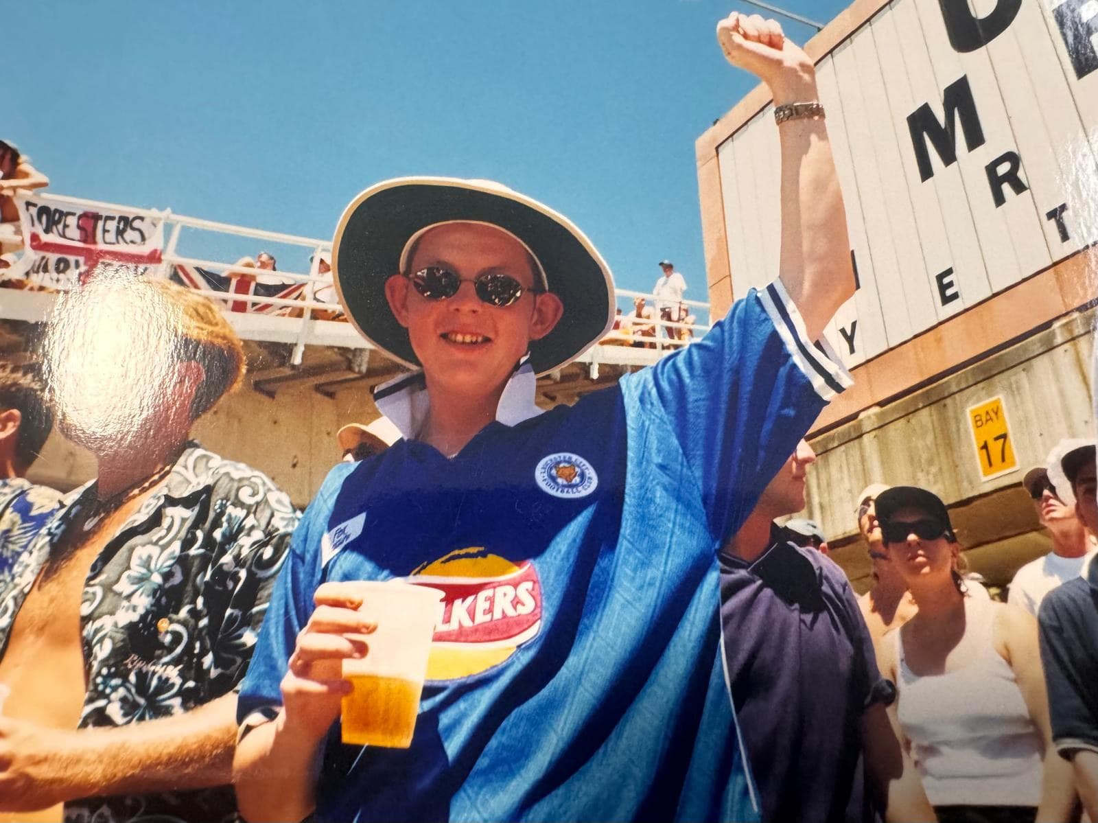 Ian Kerr aged eighteen on Yabba's Hill at the Sydney Cricket Ground in January 1999, in a Leicester City shirt and sun hat