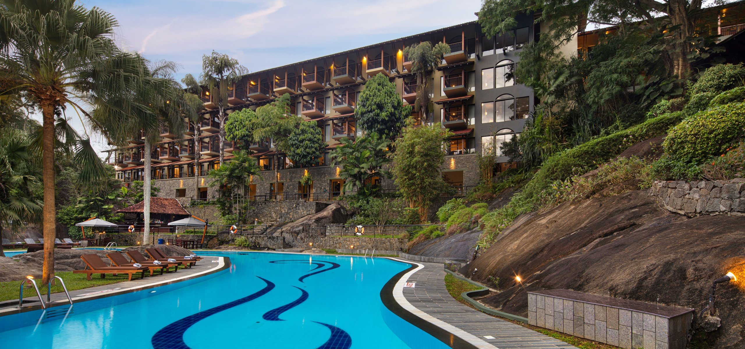 The Earl's Regency hotel in Kandy, stepped down a hillside above a curving swimming pool
