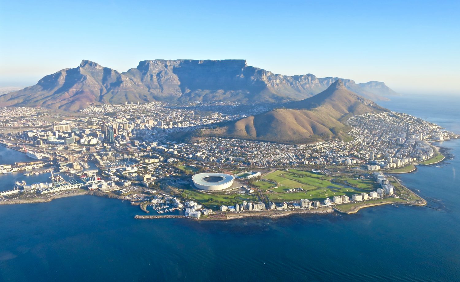 Cape Town from the air — Table Mountain, Lion's Head, Green Point Stadium and the Atlantic coastline