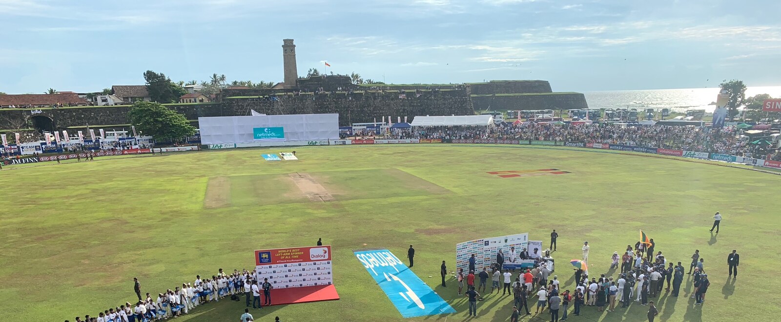 Galle International Cricket Stadium from the fort ramparts at sunset, the ocean beyond